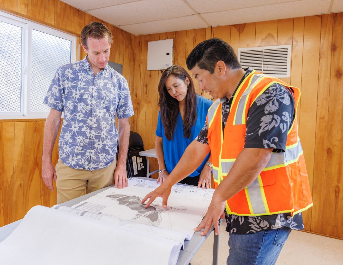 Energy contractor reviewing blueprints